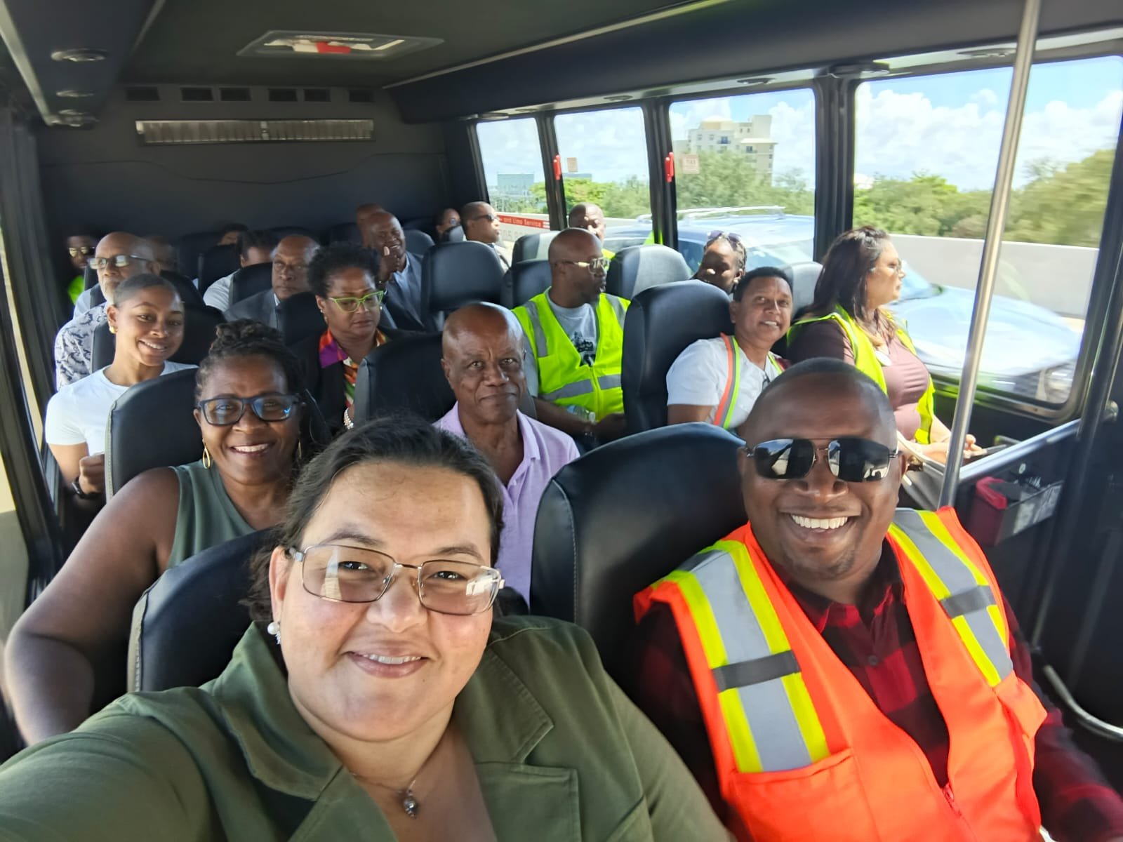 Delegates in hi-vis vests aboard the shuttle to the PortMiami tour.
